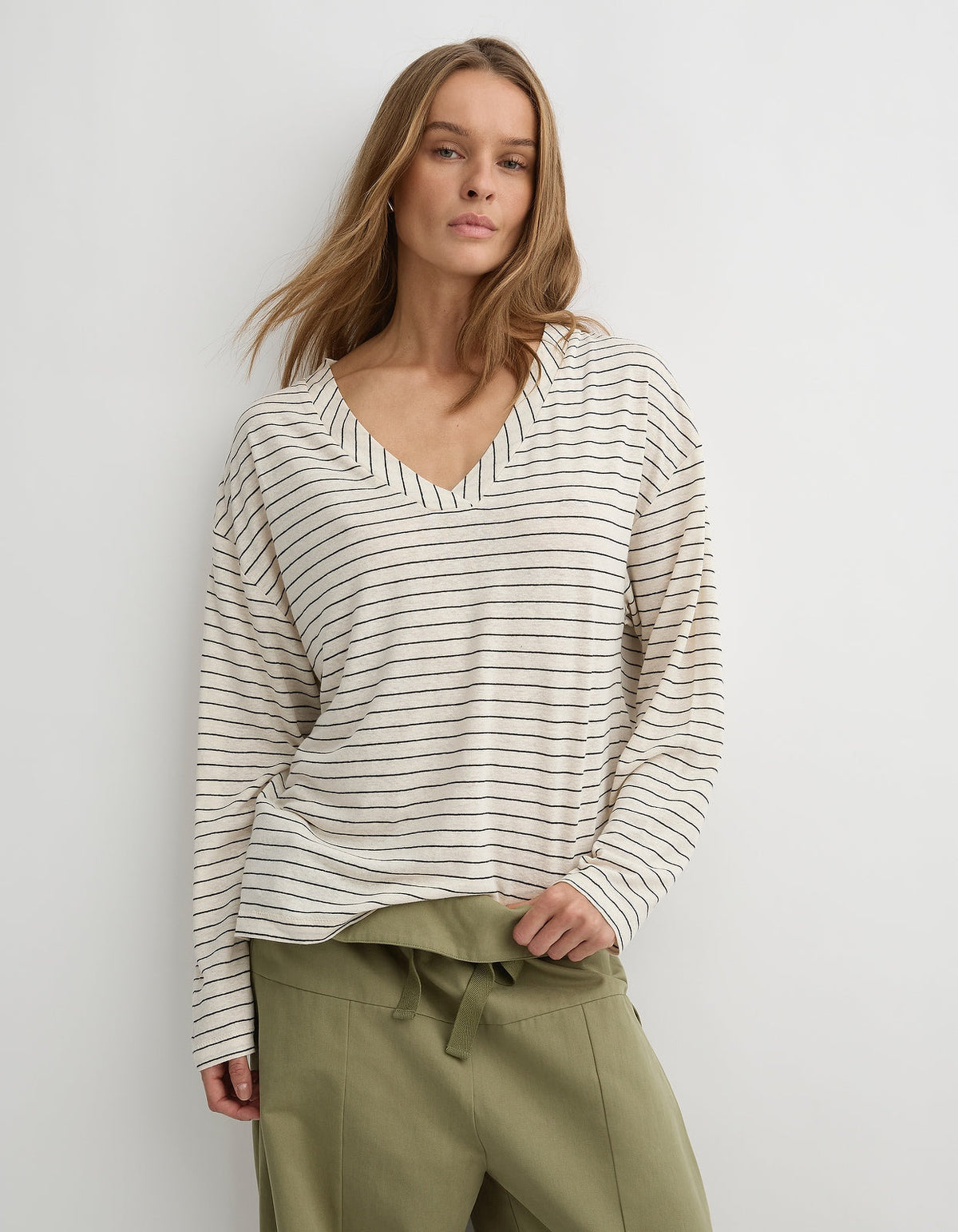 Herbert The Dylan L/S in cream and black stripe, front view of the relaxed long sleeve top with a wide V neckline