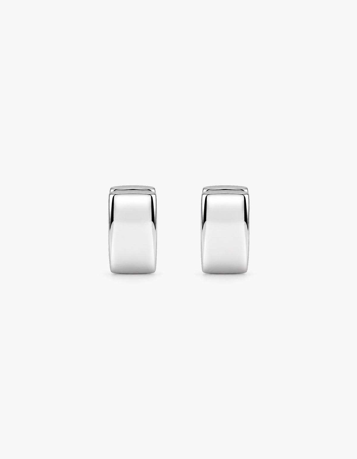 A pair of polished silver hoop earrings with a smooth, reflective finish, shown against a plain light gray background.