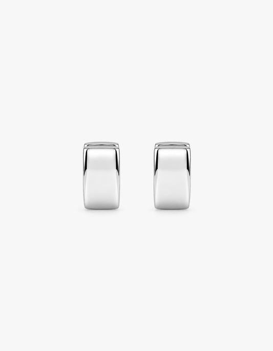 A pair of polished silver hoop earrings with a smooth, reflective finish, shown against a plain light gray background.