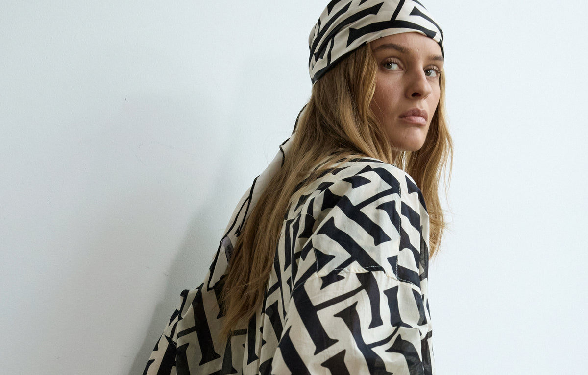 Herbert — model in monogram print shirt and headscarf